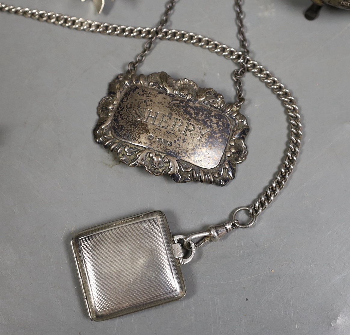 A Siamese sterling two handled ice pail with tongs, height 12.5cm, together with a cased set of six teaspoons with tongs, a silver compact a silver Vogel travelling timepiece on albert chain, three silver condiments, two